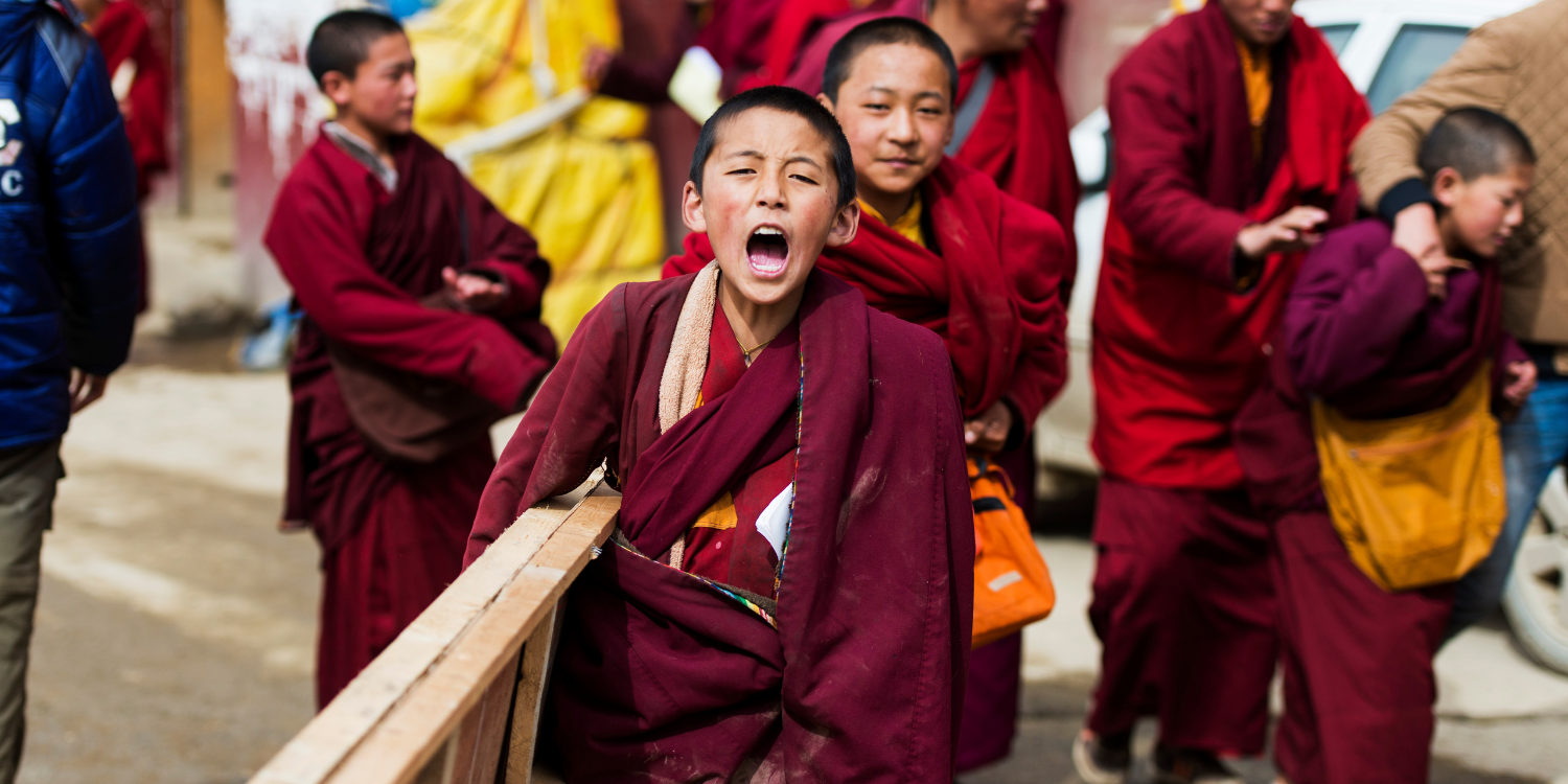 Tibetan children wearing religious robes
