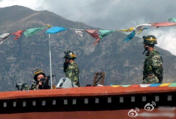 Soldiers on a rooftop in Tibet.