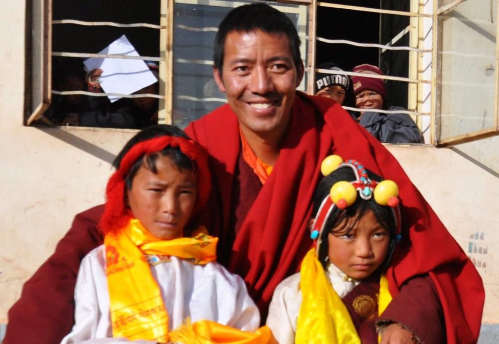 Khenpo Kartse with two children