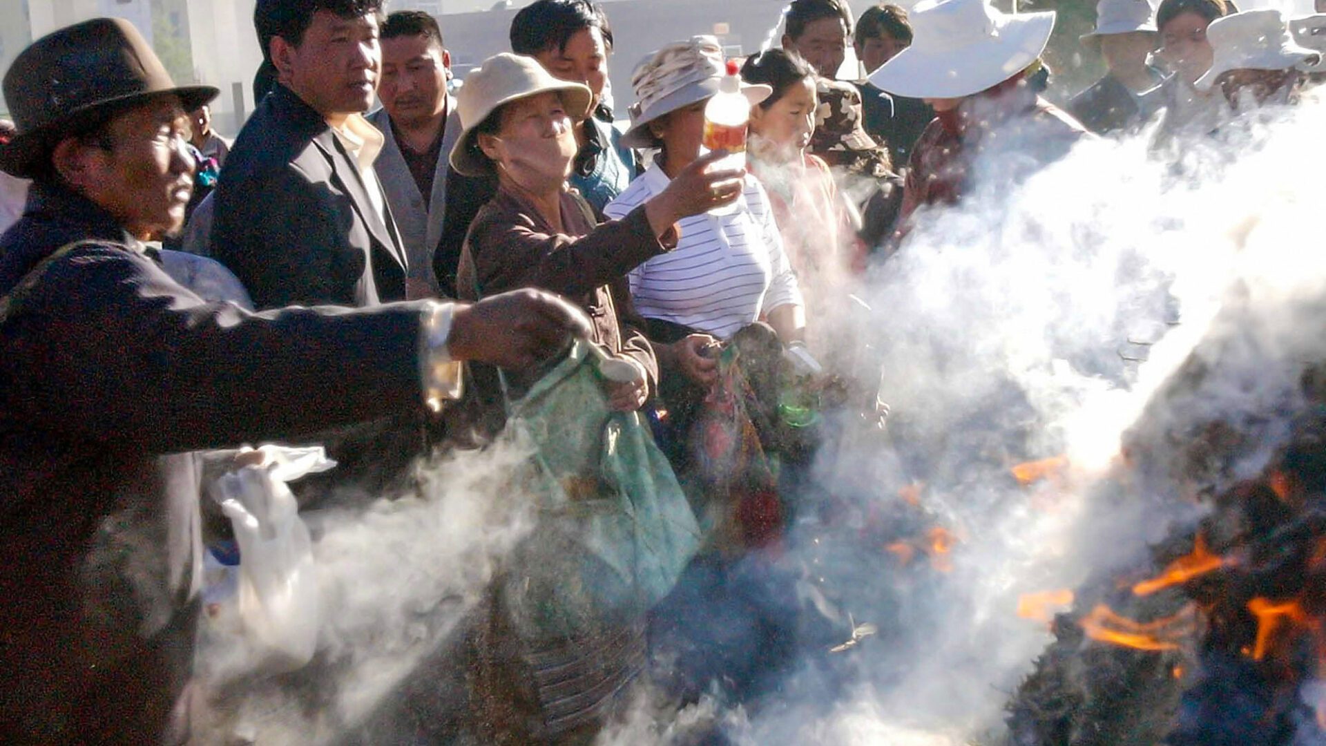 Tibetans burning juniper, an activity that has faced tight restrictions in recent years