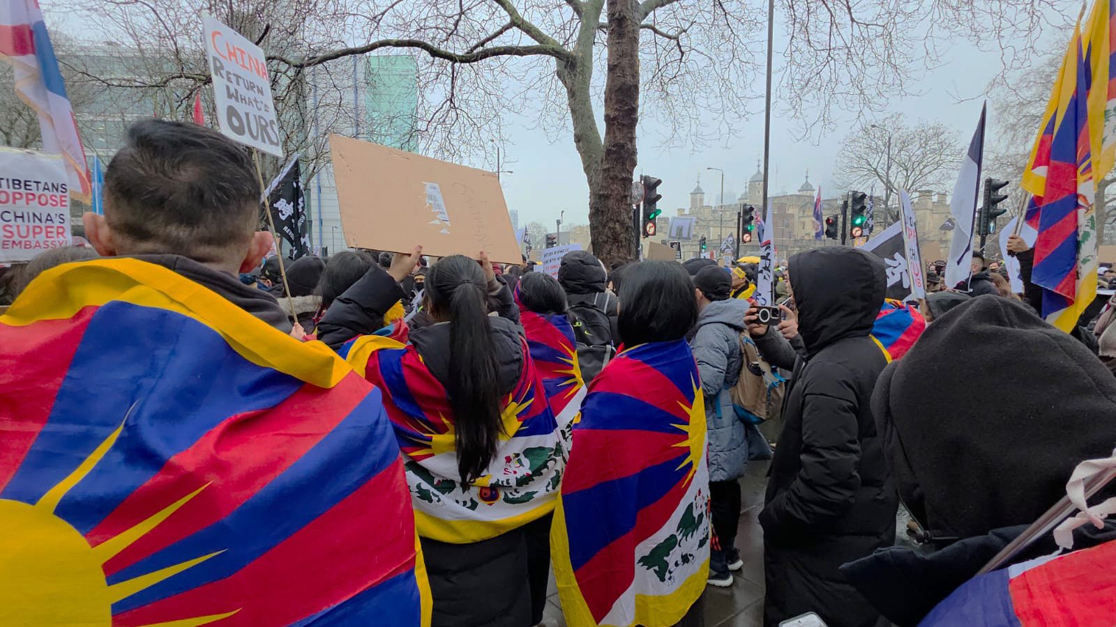 Protesters with Tibetan flags gather outside Royal Mint Court in Tower Hamlets, London, to oppose China's new embassy plans.