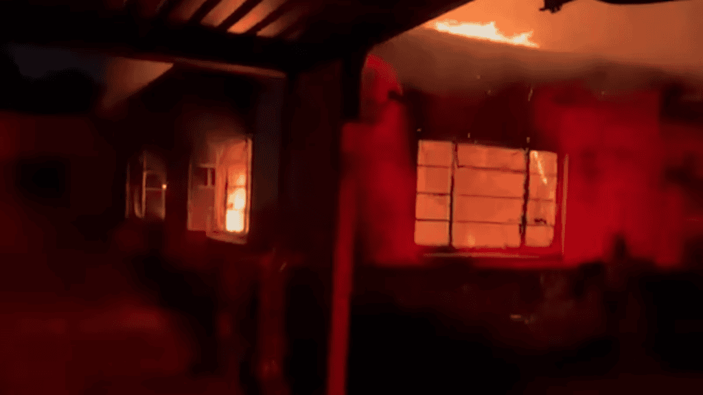 Photo shows the office of the Dalai Lama's Representative in South Africa on fire.